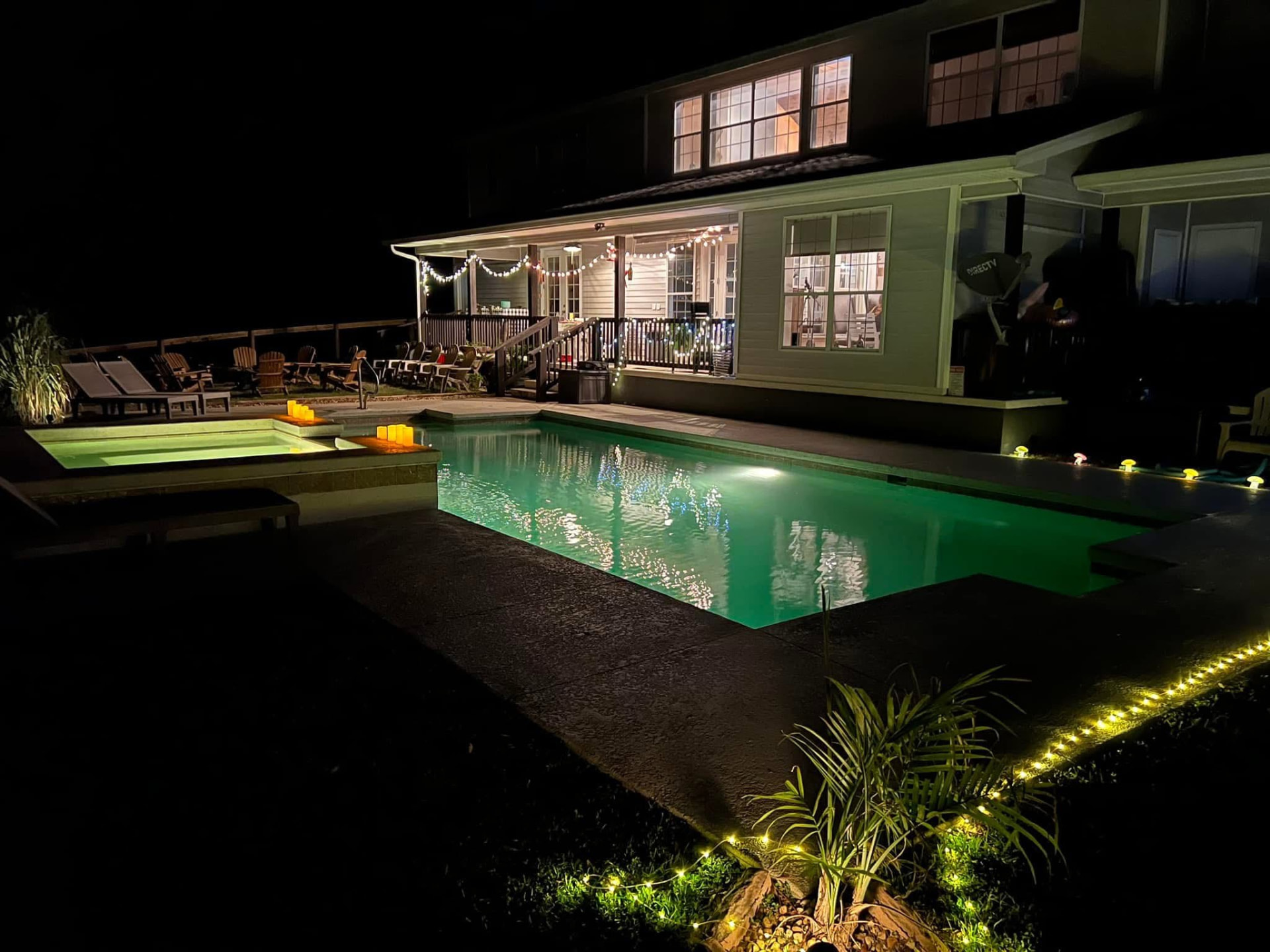 The pool at Full Circle Retreats lit at night, before an evening sound bath